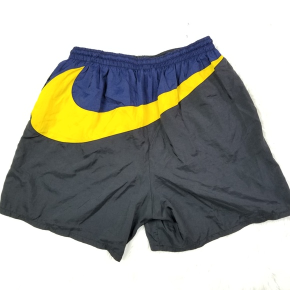 yellow nike swim trunks